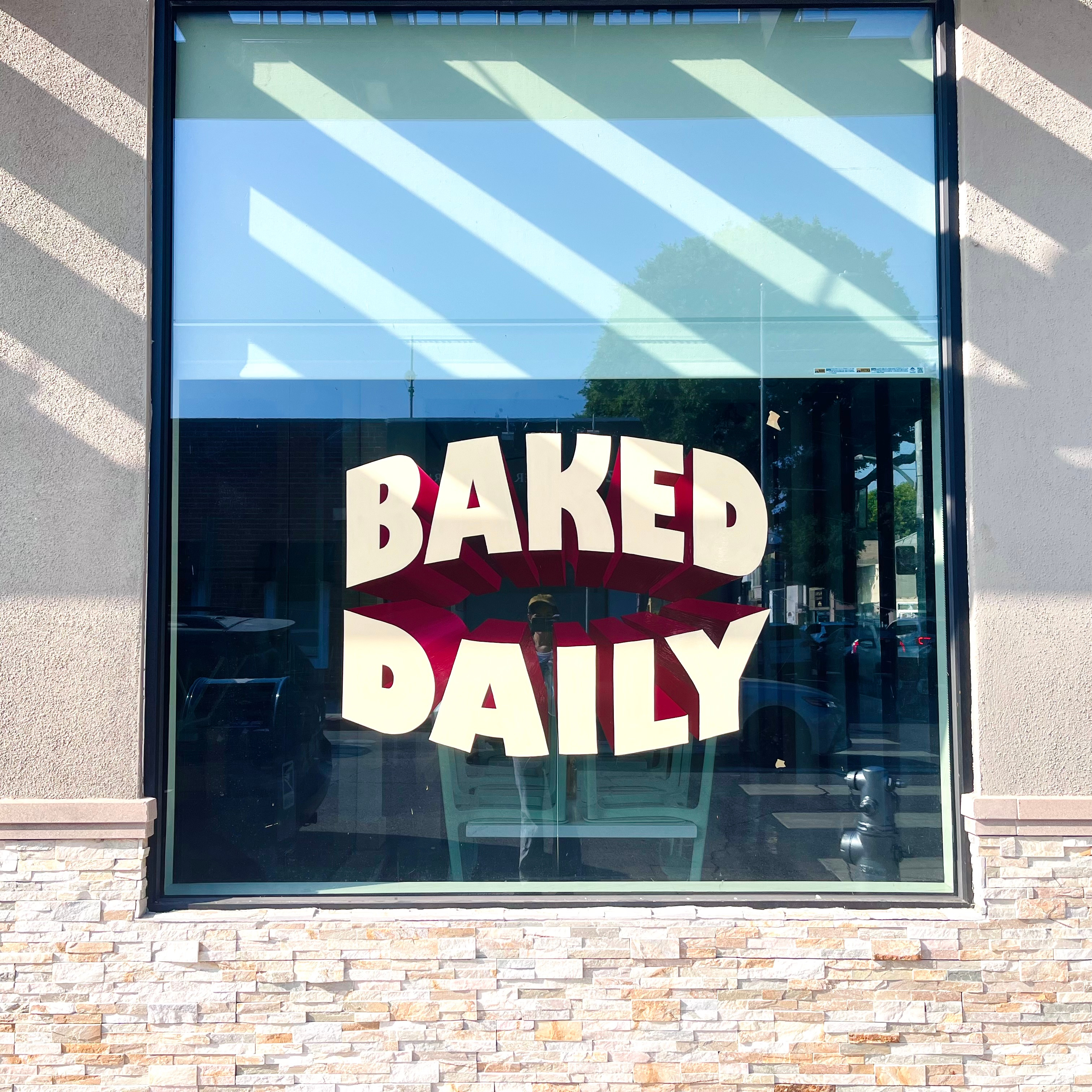 Hand painted windows for Lodge Bread - Beverly Hills beverly hills branding design environmental design hand painted logo sign graphics sign painter sign painting