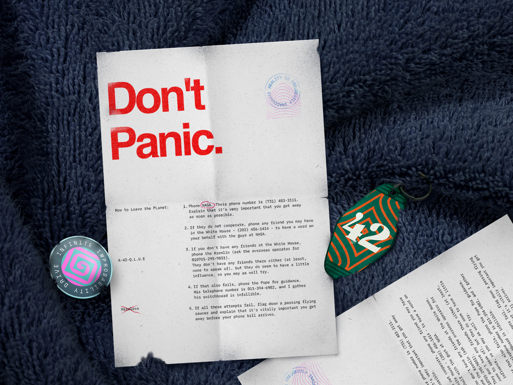 Towel: check ✅ 2026 42 branding documents freelancer futuristic graphic design illustration intergalactic guide movie movie prop nikola obradovic design ondsn poster print design retro scene sci fi space typography