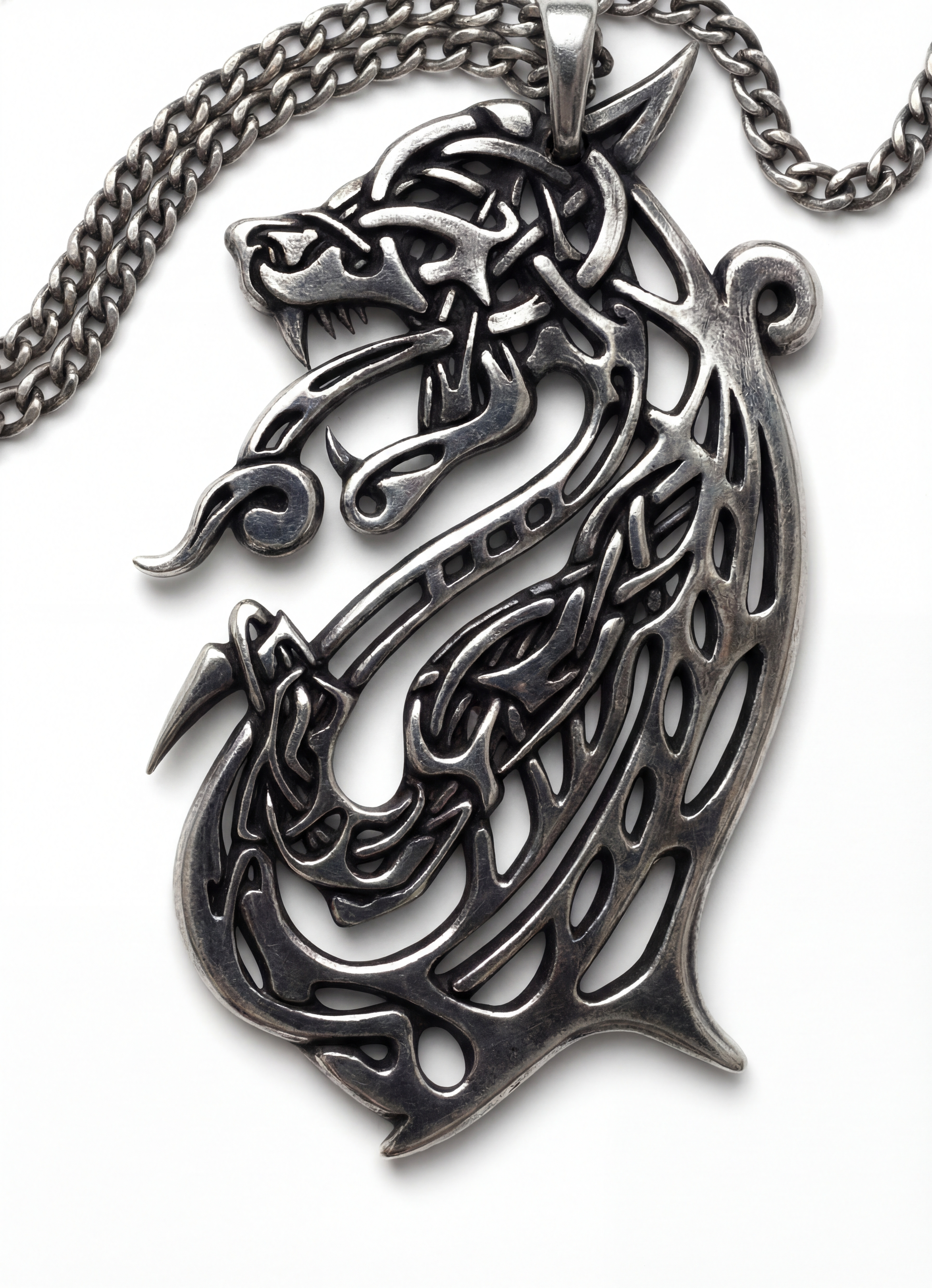 Norse Wolf Amulet – Silver Celtic Knotwork Design accessory design amulet branding celtic knot dragon fenrir graphic design intricate jewelry design logo metalwork mythology norse art product design silver pendant viking style wolf