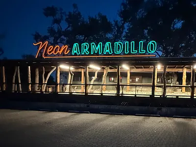 'Dillo Signage Design bbq brisket country fonts graphic design hill lights neon orange sign signage tacos teal texas texmex typography wimberley