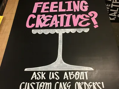 “Feeling Creative?” – Custom Cake Sign bakery branding chalkboard art custom typography environmental desig experiential design grocery branding hand lettering in store graphics retail signage visual merchandising