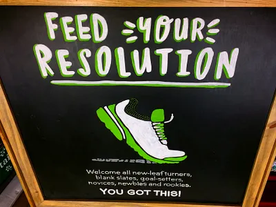 “Feed Your Resolution” – New Year Retail Chalk Sign chalk art environmental design experiential retail grocery marketing hand lettering retail signage seasonal campaign typography design visual merchandisin wellness branding