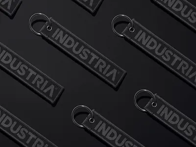 INDUSTRIA® Keychains / A Study in Tonal Branding. brand identity brand merch branding branding agency branding inspiration creative direction dark aesthetic design studio editorial design industria keychain design logo design luxury branding merchandise design minimal branding modern branding monochrome design premium branding tonal branding visual identity