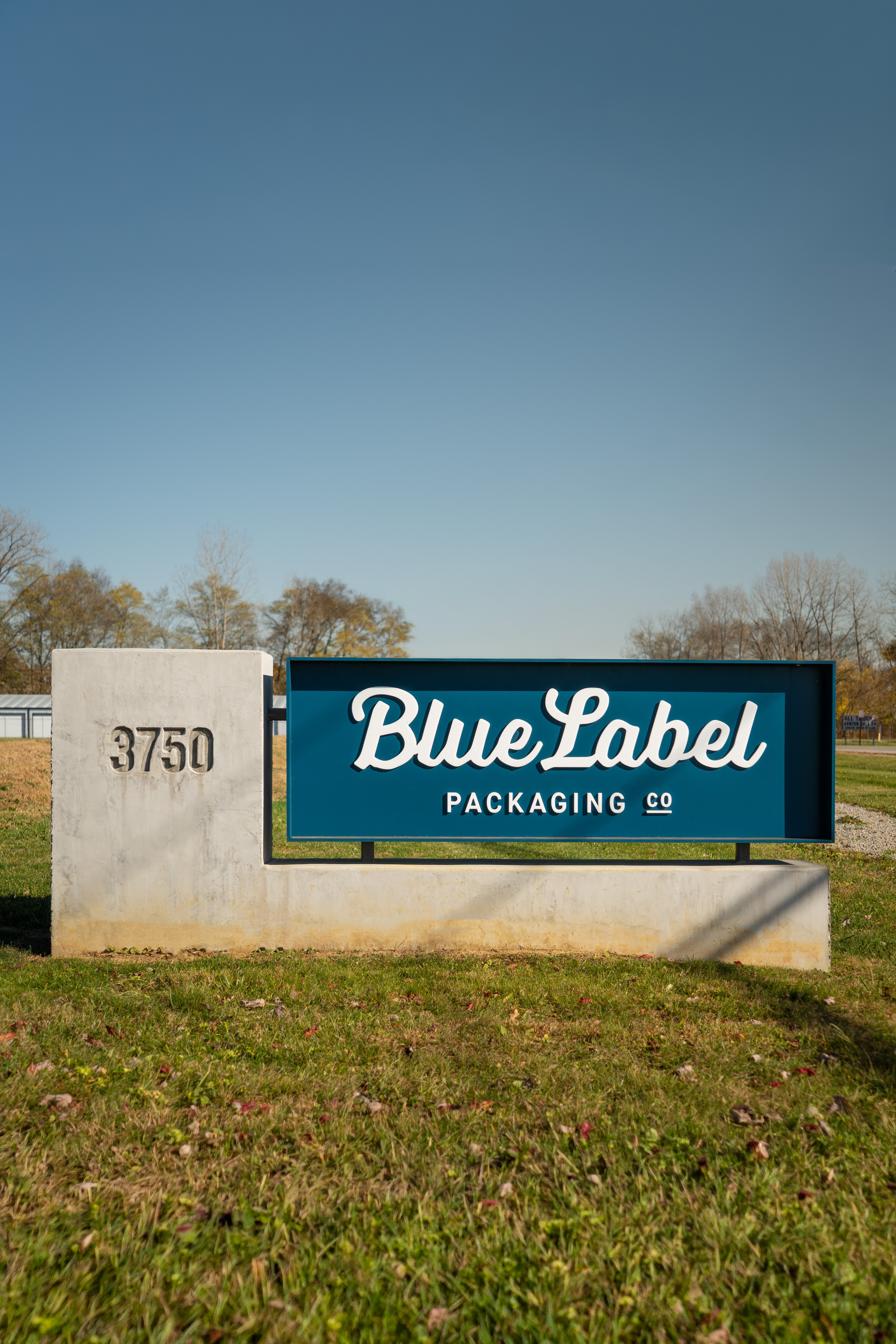 Blue Label Signage blue blue label branding cursive exterior label logo ohio packaging printer script signage type typography