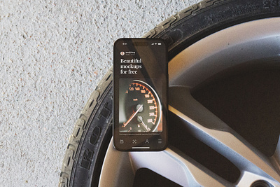 Car Mechanic iPhone 14 Pro Mockup on Wheel 14 car free iphone mechanics mockup photoshop pro psd tire wheel