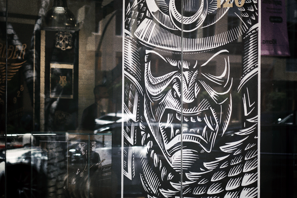 Bushido window illustration at Nightrider Jewelry black and white bushido design hand drawn illustration line work samurai store front vector window installation woodcut