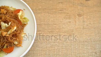 stir fried vermicelli with vegetable and egg footage. noodles