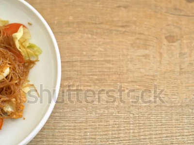 stir fried vermicelli with vegetable and egg footage. noodles