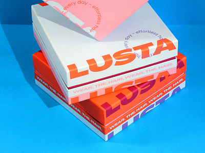 Lusta - Packaging Boxes blue bold boxes branding collateral contrast design fun graphic design hair logo minimal orange packaging pink strong toppers typography vector wigs