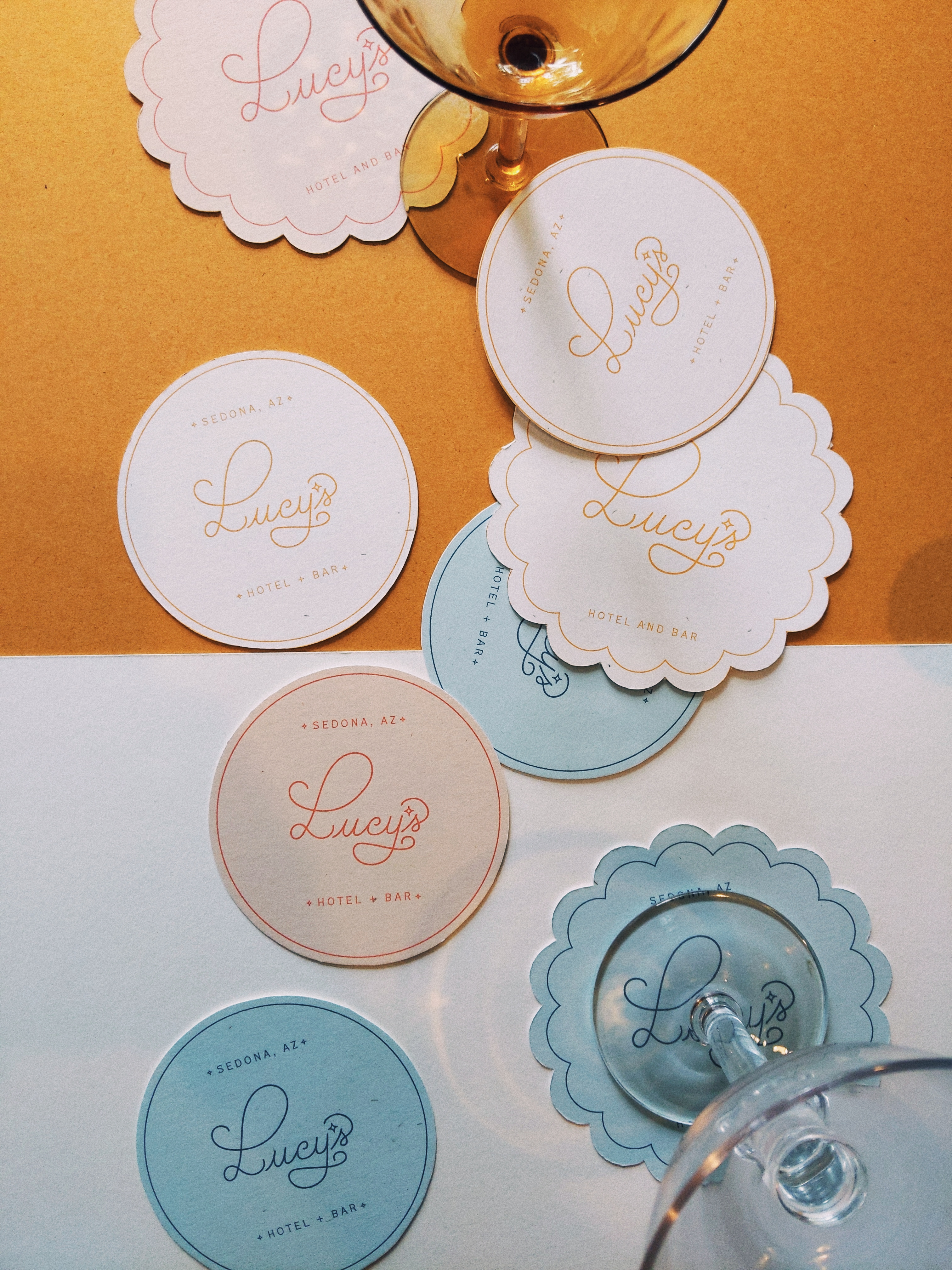 Lucy's Hotel + Bar Branding and Print Design bar branding design bar logo design boutique hotel branding coaster design fun branding fun typography hand drawn typography hotel branding hotel logo design luxury bar branding luxury hotel branding retro branding design script typography