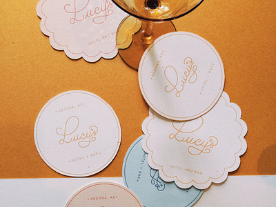 Lucy's Hotel + Bar Branding and Print Design bar branding design bar logo design boutique hotel branding coaster design fun branding fun typography hand drawn typography hotel branding hotel logo design luxury bar branding luxury hotel branding retro branding design script typography