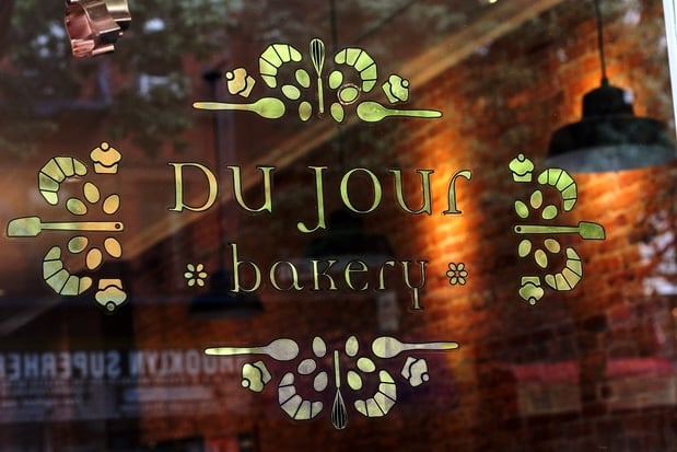 Du Jour Bakery gold foil logo on glass door