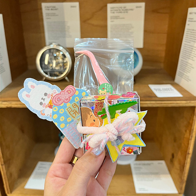 Packaging sold artwork at Kult Gallery amulet art exhibition art toy character design cute design designer toy dollhouse felt fine arts gallery kawaii lucky charm miniature omamori packaging