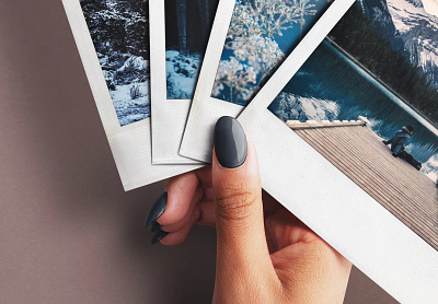 Hand Holding Fan of Four Instant Photos Mockup branding graphic design hand holiday instant photo mockup