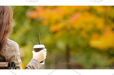 Fall concept - beautiful woman autumn coat concept disposable enjoying fall fashion girl one outdoor park people person red tea woman young